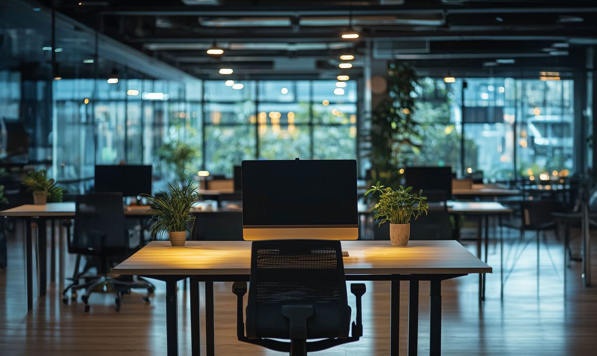An empty desk in a modern Indonesian tech office.